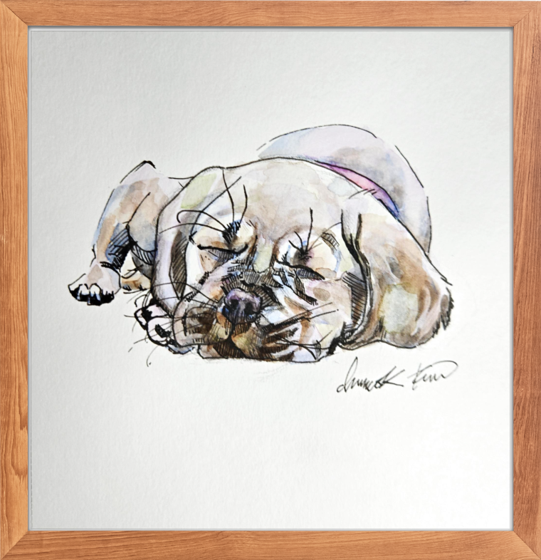 A framed watercolour resting in the studio